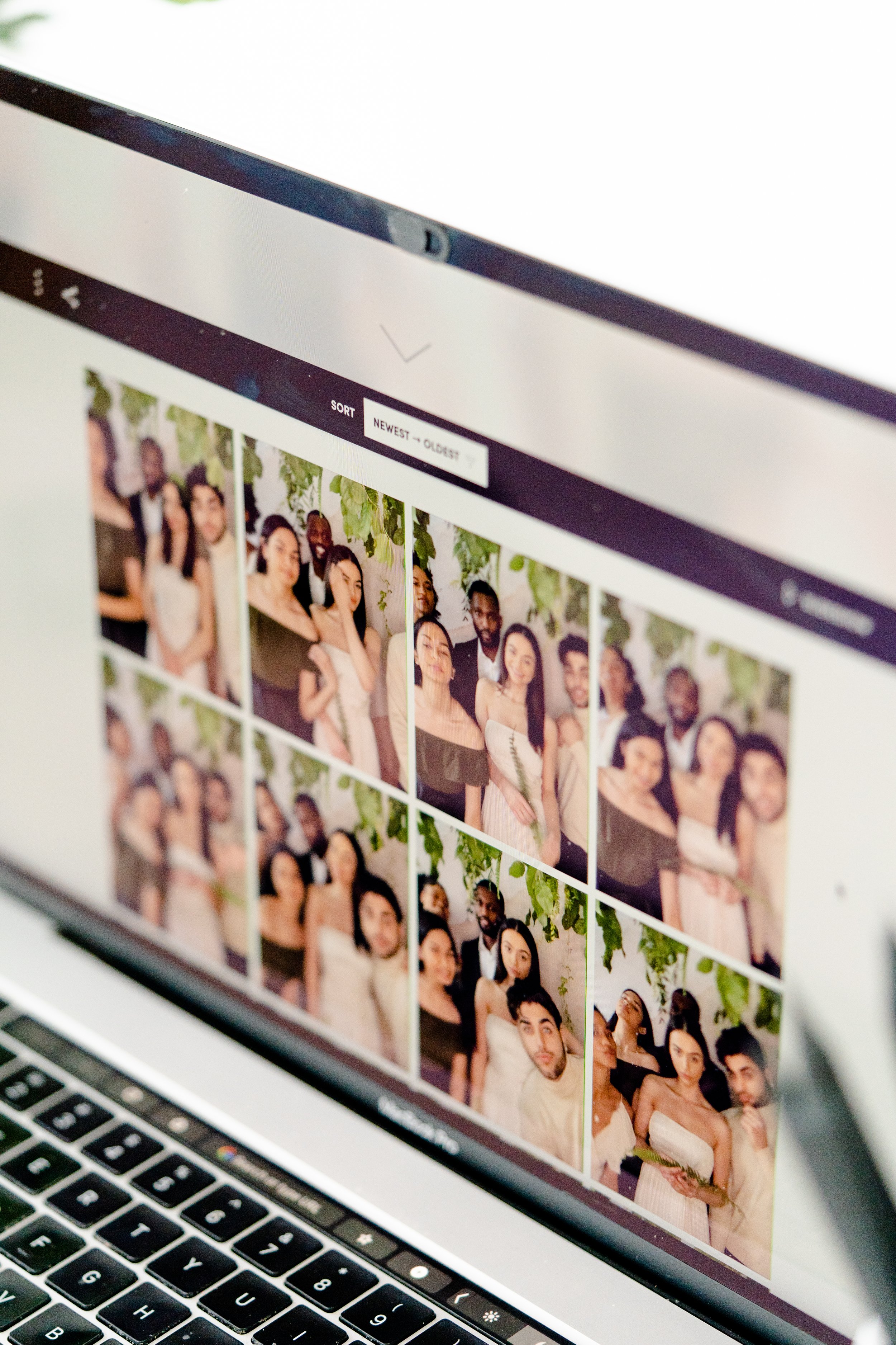 Guest holding photo strips